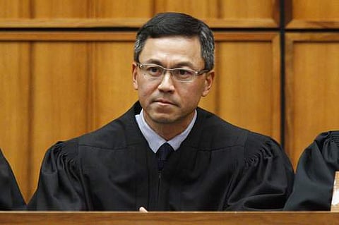 This December 2015 photo shows U.S. District Judge Derrick Watson in Honolulu. | AP