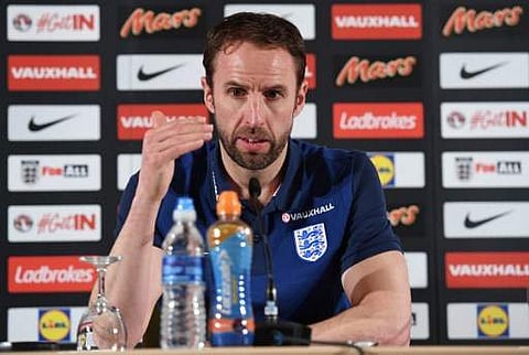 England's Manager Gareth Southgate addresses a press conference in Essen, western Germany, on March 21, 2017, on the eve of the friendly football match between Germany and England, whiich is also Lukas Podolski's last match with the German team. | AFP