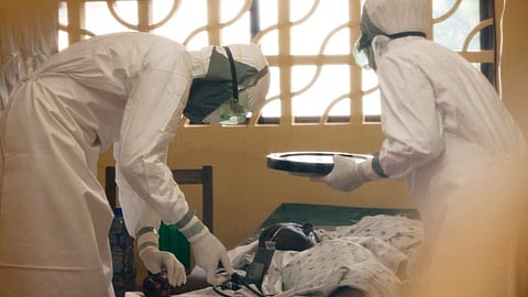 A file photo of doctors treating an Ebola victim. (File photo | AP)