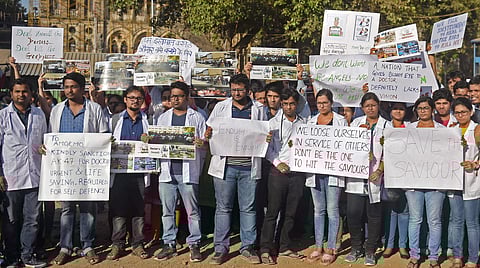 Resident doctors protest at the Azad Maidan demanding security after a intern was assaulted by patient's relatives in Mumbai on Tuesday. | File | PTI)