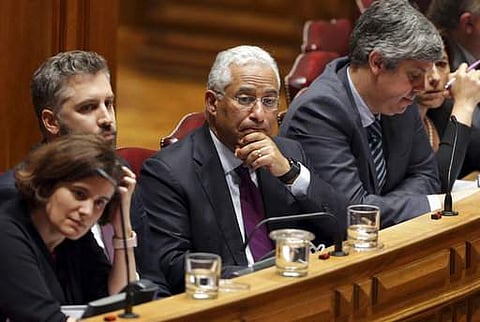 Portugal's Prime Minister Antonio Costa, center, listens during a debate at the Portuguese parliament in Lisbon Wednesday, March 22 2017. | AP