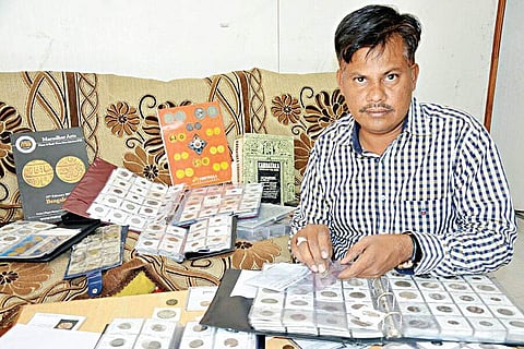 Mohammed Ismail with his collection of coins | Express