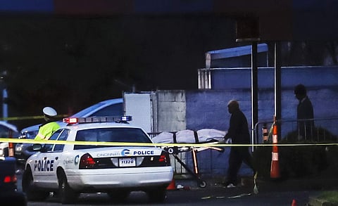 A body is removed as police work at the Cameo club after a fatal shooting, Sunday, March 26, 2017, in Cincinnati. | AP