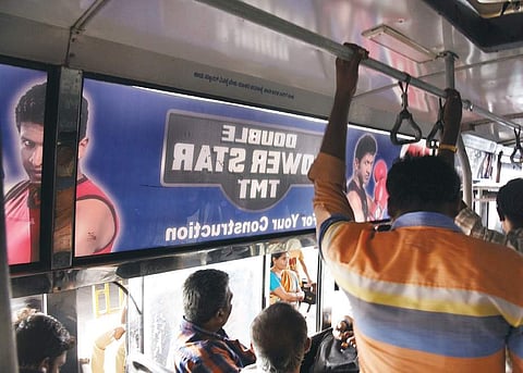 Advertisements on the side panels of BMTC buses make it quite difficult for passengers who are standing to keep track of bus stops | Express