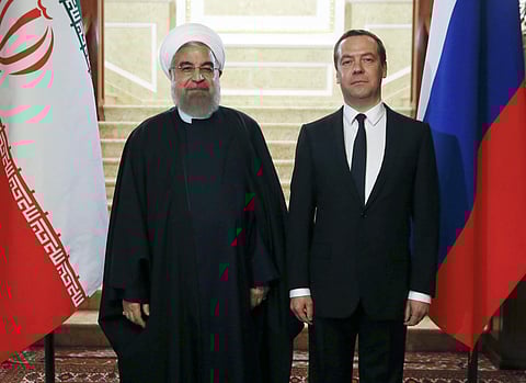 Russian Prime Minister Dmitry Medvedev, right, and Iranian President Hassan Rouhani pose for a photo during their meeting in the Gorky residence outside Moscow, Russia, Monday, March 27, 2017. | AP