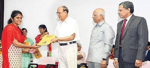 A student receiving award from GITAM chancellor K Ramakrishna Rao as vice-president M Gangadhara Rao, V-C MS Prasada Rao look on, in Vizag on Tuesday | Express