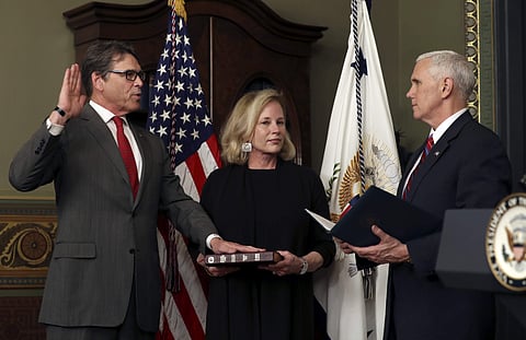Vice President Mike Pence administers the oath of office to Energy Secretary Rick Perry as his wife Anita holds the Bible, Thursday, March 2, 2017, in the Eisenhower Executive Office Building on the White House complex in Washington. | AP