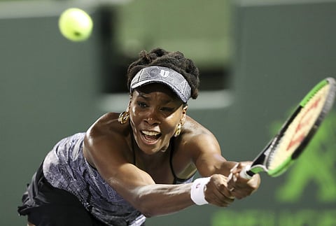 Venus Williams, of the United States, tries to return a shot against Angelique Kerber, of Germany, during a quarterfinal match at the Miami Open tennis tournament. | AP