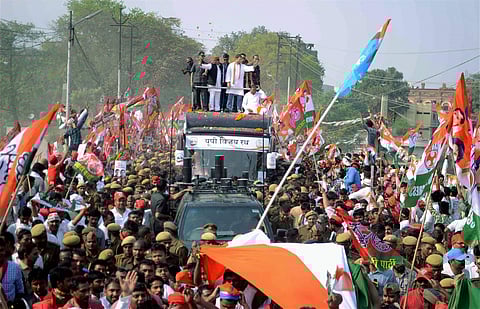 Uttar Pradesh Chief Minister Akhilesh Yadav and Congress Vice-President Rahul Gandhi during their road show in Varanasi | PTI