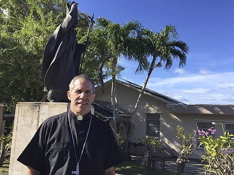 Archbishop Michael Byrnes poses for a photo in front of his residence in Hagatna, Guam, Friday, March 3, 2017. (Photo | AP)