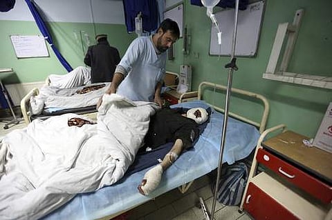 Injured men recover at a hospital after a suicide attack in Kabul, Afghanistan. | AP