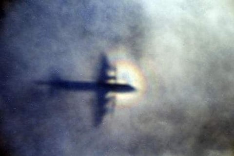 Shadow of a Royal New Zealand Air Force P3 Orion is seen on low level cloud while the aircraft searches for missing Malaysia Airlines Flight MH370 in the southern Indian Ocean (Photo | AP)