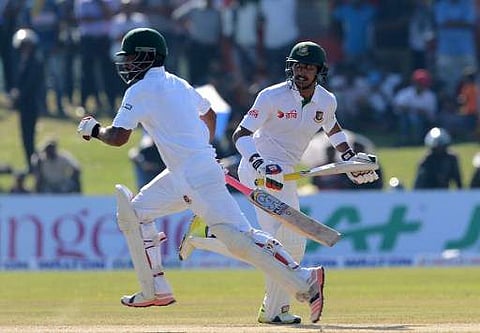 Bangladesh cricketers Soumya Sarkar (R) and Tamim Iqbal (L) run between the wickets during the second day of the opening Test cricket match between Sri Lanka and Bangladesh at The Galle International Cricket Stadium in Galle on March 8, 2017. | AFP