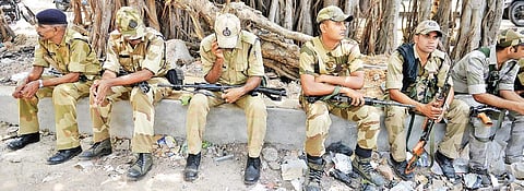 Paramilitary forces prepare to leave after the by-election was called off in RK Nagar, on Monday | D SAMPATHKUMAR