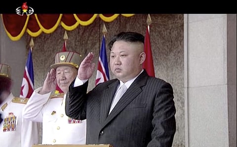 In this image made from video broadcast by North Korean broadcaster KRT, North Korea's leader Kim Jong Un salutes during a parade at Kim Il Sung Square in Pyongyang. (Photo | AP)
