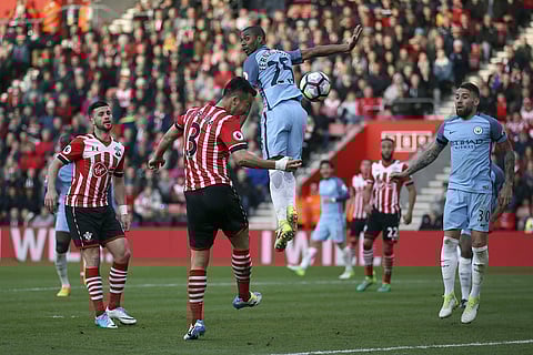 Southampton's Maya Yoshida, second left, steers a header towards goal but fails to score against Manchester City during the English Premier League soccer match at St Mary's Stadium. | AP