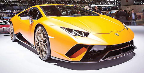 Luxury cars drive into small towns