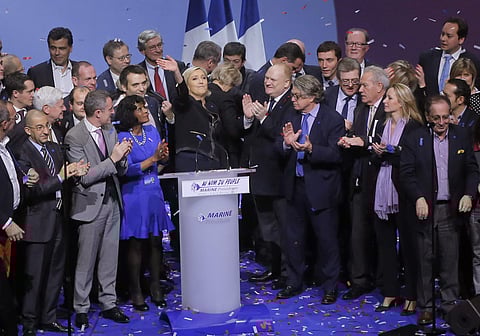 Far-right leader presidential candidate Marine Le Pen waves to supporters as she stands among her party officials at the end of a conference in Lyon, France, Sunday Feb 5, 2017. (Photo |AP)