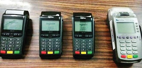 Card swiping machines seized from the gang