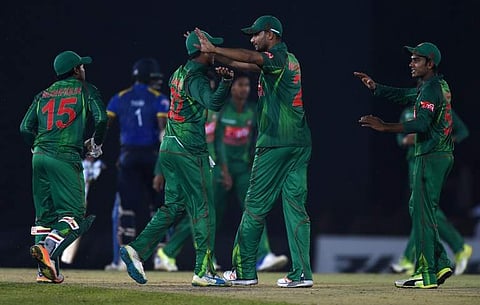 Bangladesh cricket captain Mashrafe Mortaza (2ndR) celebrates with teammates after Bangladesh defeated Sri Lanka by 90 runs in the first one day international (ODI) cricket match between Sri Lanka and Bangladesh at The Rangiri Dambulla International Crick