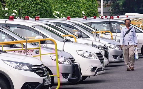 Government cars, all with red beacons, parked outside Vidhana Soudha on Wednesday | Vinod Kumar T