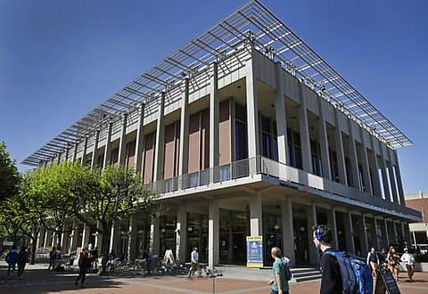 Students walk past the Student Union building where Milo Yiannopoulous was scheduled to speak on the University of California at Berkeley campus on Friday, April 21. (File Photo | AP)
