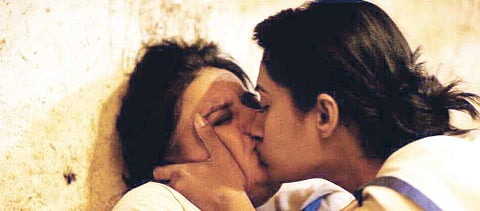 Pooja Gandhi kissing a female co-star in Dandupalya 2