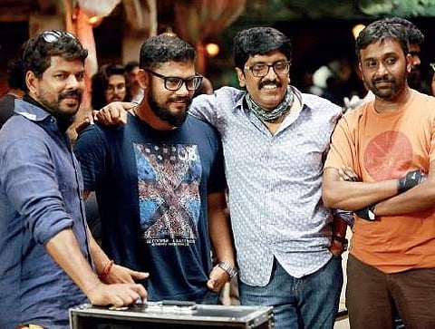 Shameer Mohammed (second from left) with director B Unnikrishnan on the sets of Mohanlal-starrer VillaIn