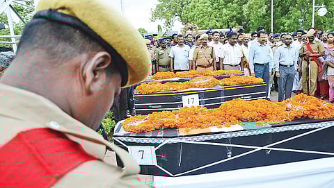 Cops paying homage to the mortal remains of the three CRPF soldiers at the Tiruchy airport on Tuesday | M K Ashok Kumar