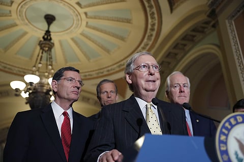 Senate Majority Leader Mitch McConnell of Ky., accompanied by, from left, Sen. John Barrasso, R-Wyo., Sen. John Thune, R-S.D., and Senate Majority Whip John Cornyn of Texas, speaks during a media availability following a policy luncheon, Tuesday, April 25