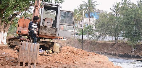 The earth mover that broke down even before the de-weeding work started at Bellandur Lake on Wednesday; Below: IISc team collect samples from the lake | pushkar v