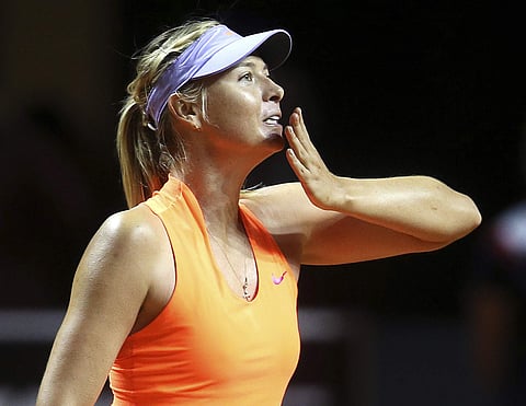 Russia's Maria Sharapova blows a kiss after winning 7-5, 6-3 against Italy's Roberta Vinci at the Porsche Tennis Grand Prix in Stuttgart, Germany, Wednesday, April 26, 2017. | AP