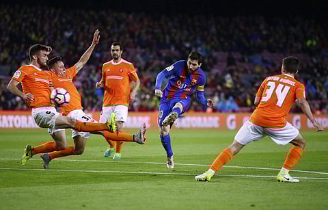 FC Barcelona's Lionel Messi, second right, kicks the ball to score during the Spanish La Liga soccer match between FC Barcelona and Osasuna at the Camp Nou stadium in Barcelona, Spain, Wednesday, April 26, 2017. | AP