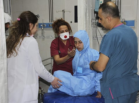 Turkish medics check a victim of alleged chemical weapons attacks in Syrian city of Idlib, at a local hospital in Reyhanli, Hatay, Turkey. (File | AP)