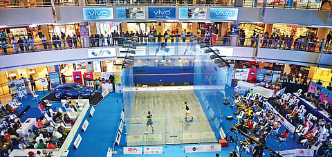 View of the glass court at the Express Avenue mall in Chennai which is being used in the ongoing Asian Squash Championships; (below) Dipika Pallikal in action on Friday | (D Sampathkumar | EPS)