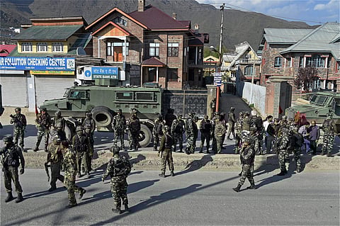 Security personnel at the scene of militant attack on CRPF convoy near Pantha Chowk in the outskirts of Srinagar along Srinagar-Jammu national highway on Monday. Six CRPF personnel and a girl were injured in the attack. | PTI