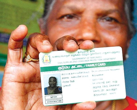 A woman displaying her smart public distribution system card at a ration shop in Korattur | Express