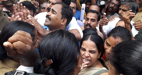 Police overpower Mahija, mother of Jishnu Prannoy, along with other family members for staging a protest in front of the state police headquarters in Thiruvannathapuram demanding arrest of culprits. (Kaviyoor Santhosh | EPS)