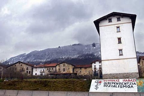This file photo taken on February 24, 2006 in the northern Spanish village of Bakaiku, Navarra province shows Basque separatist group ETA's logo with a slogan in Basque: 'To Win Fighting. (File Photo |AFP)