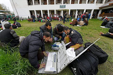 Polling staff checking EVMs before heading to polling station for by-election to the Srinagar Lok Sabha seat in Srinagar on Saturday. | PTI