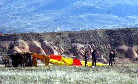 Security members investigate at the site after a hot air balloon hit a high-voltage transmission line and crashed near Cappadocia, a popular tourist destination in central Turkey on April 9. (Photo | AP)