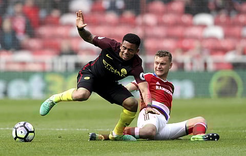 Middlesbrough's Ben Gibson, right, and Manchester City's Gabriel Jesus in action during their English Premier League soccer match at the Riverside Stadium in Middlesbrough. | AP