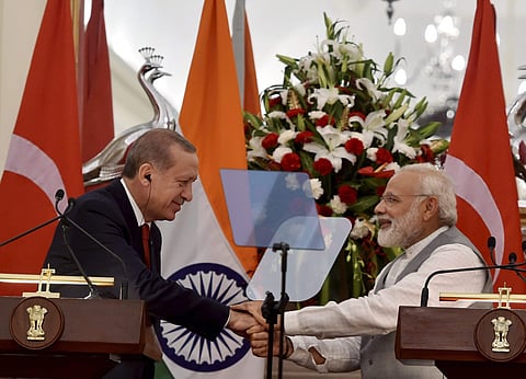 Prime Minister Narendra Modi shakes hands with Turkish President Recep Tayyip Erdogan after their joint statement at Hyderabad House in New Delhi on Monday. | PTI