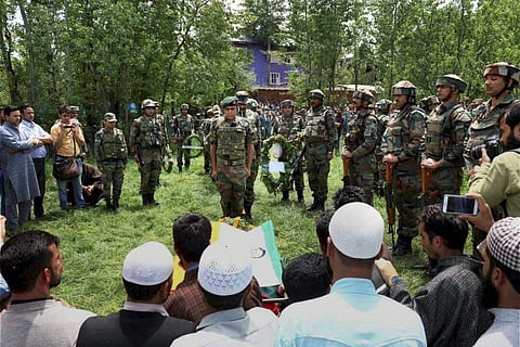 rmy personnel paying their respects to the slain army officer Lt. Ummer Fayyaz during his funeral at his native village Sudsona in Kulgam district on Wednesday. (PTI)
