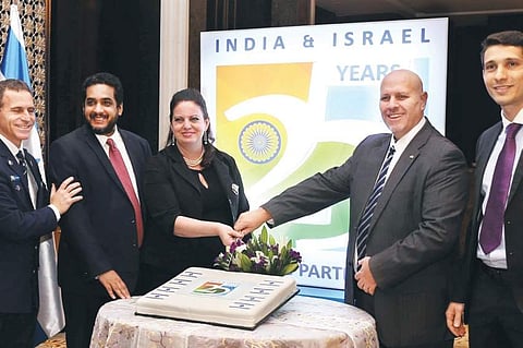 Israeli Consul General Yael Hashavit (third from left) and Deputy Chief of Mission Ziv Shavi (second from right) with other delegates at the party