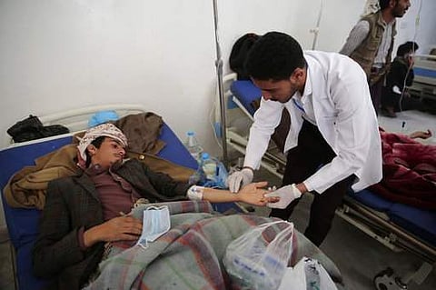 A man is treated for suspected cholera infection at a hospital in Sanaa, Yemen, Sunday, May. 7, 2017. Scores of people have been hospitalized with suspected cholera in Sanaa. | AP