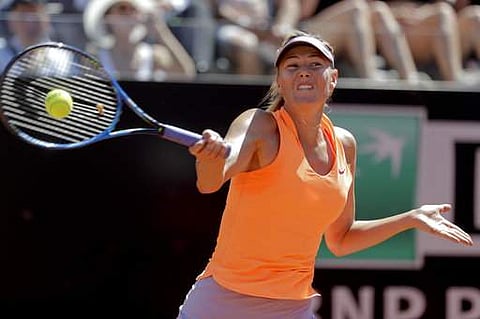 Maria Sharapova, of Russia, returns the ball to Christina Mchale, of the United States, during the Italian Open tennis tournament. | AP
