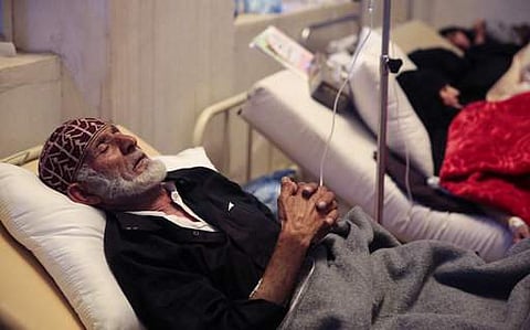 An elderly man is treated for a suspected cholera infection at a hospital in Sanaa, Yemen. | AP
