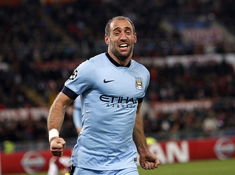 In this Wednesday Dec. 10, 2014 file photo, Manchester City's Pablo Zabaleta celebrates after scoring his side second goal during a Group E Champions League soccer match between Roma and Manchester City at the Olympic stadium in Rome, Italy. | AP