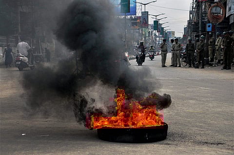 Agartala Congress workers burn a tyre during their day-long bandh and protest in Agartala Tripura on Thursday. (PTI)